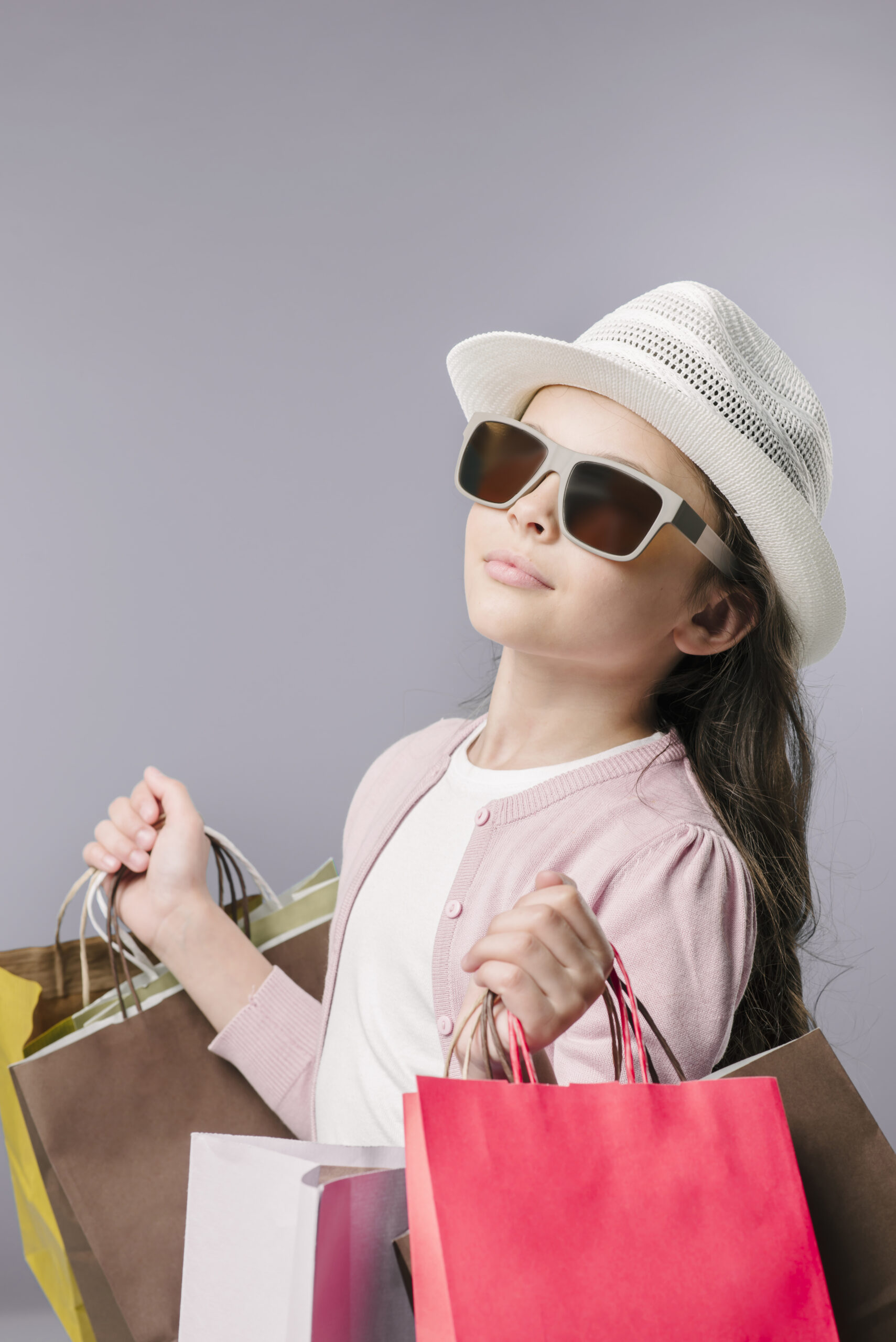 girl-sunglasses-posing-with-shopping-bags
